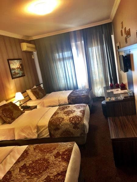 Üç Kişilik Deluxe Deniz Manzaralı Oda - İade Edilmez 2